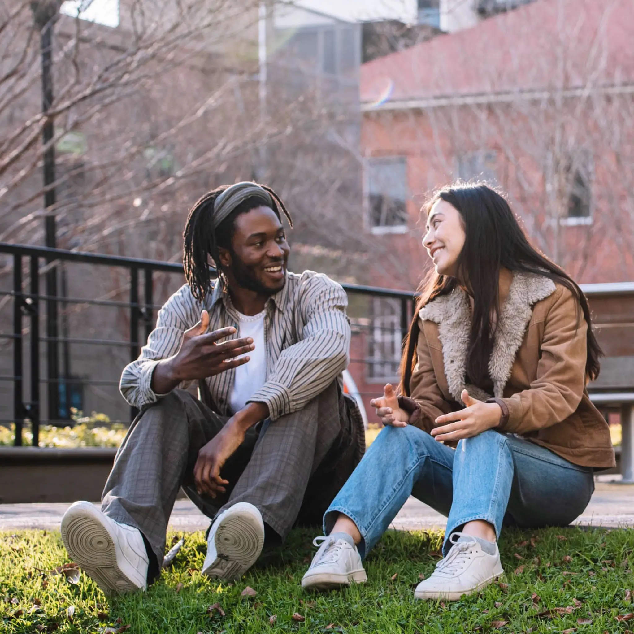 Group sitting on grass SQ 2